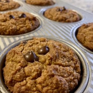 pumpkin-based muffin pictured with chocolate chips