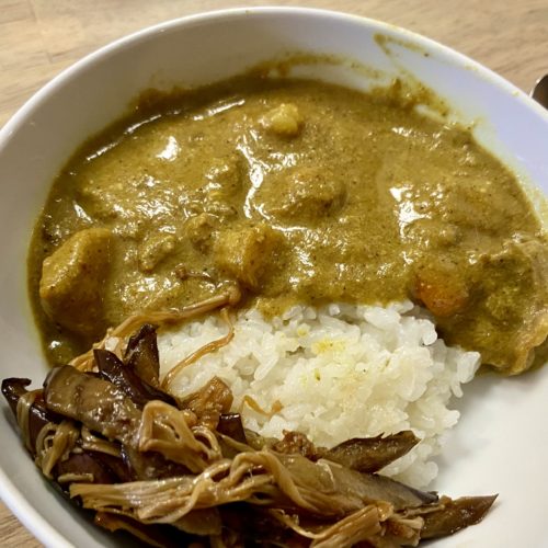 Bowl of curry and rice and a side