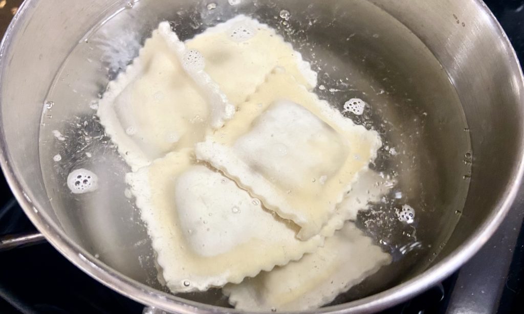 Raviolis in a pot of water